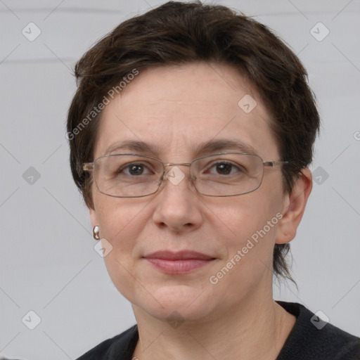 Joyful white adult female with short  brown hair and grey eyes