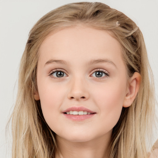 Joyful white child female with long  brown hair and brown eyes