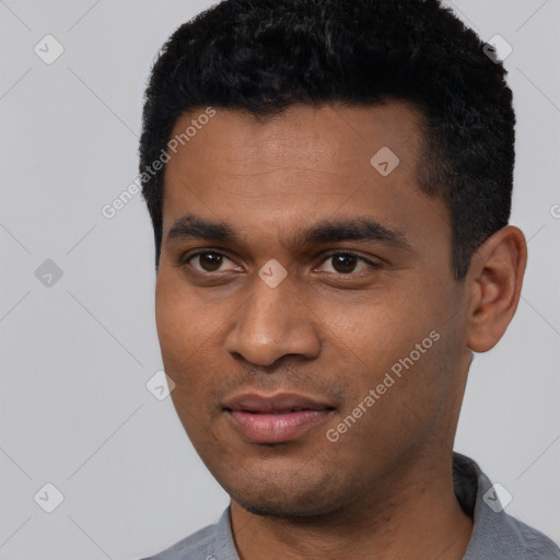 Joyful black young-adult male with short  black hair and brown eyes