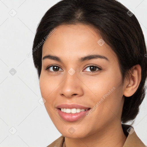 Joyful latino young-adult female with medium  brown hair and brown eyes