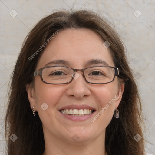 Joyful white adult female with long  brown hair and grey eyes