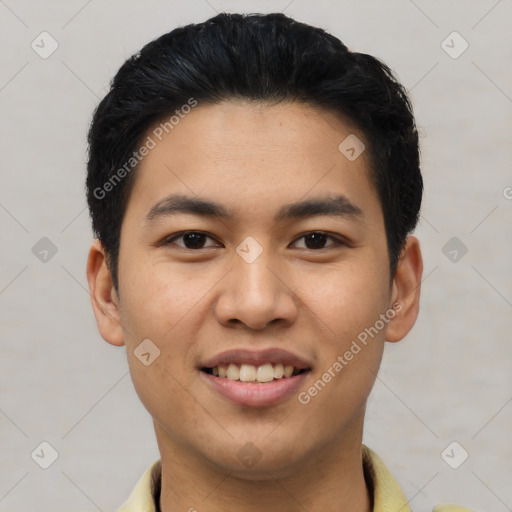 Joyful asian young-adult male with short  black hair and brown eyes