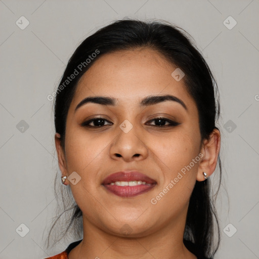 Joyful latino young-adult female with medium  brown hair and brown eyes