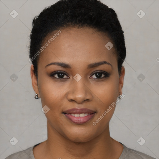 Joyful black young-adult female with short  brown hair and brown eyes