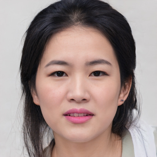 Joyful asian young-adult female with medium  black hair and brown eyes
