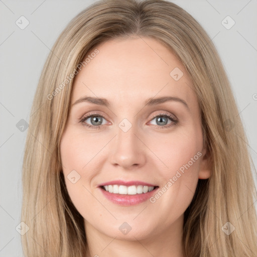 Joyful white young-adult female with long  brown hair and grey eyes