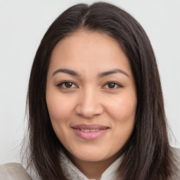 Joyful latino young-adult female with long  brown hair and brown eyes