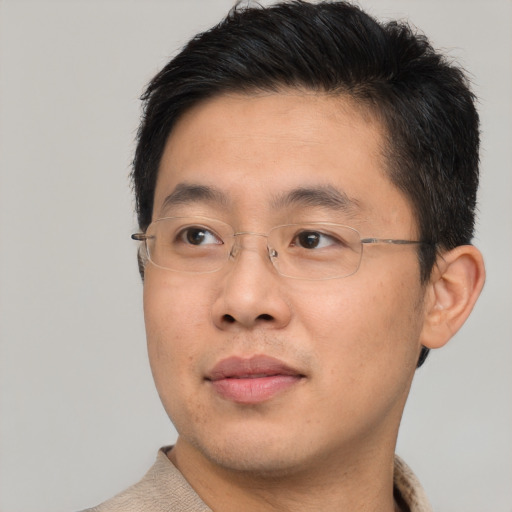 Neutral asian young-adult male with short  brown hair and brown eyes