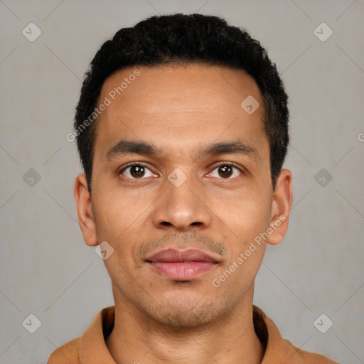 Joyful latino young-adult male with short  black hair and brown eyes