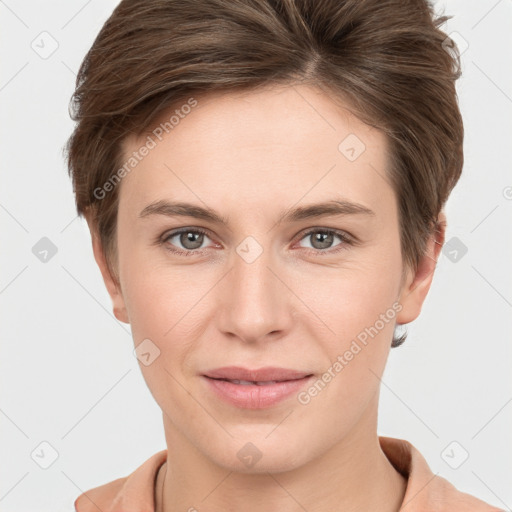 Joyful white young-adult female with short  brown hair and grey eyes