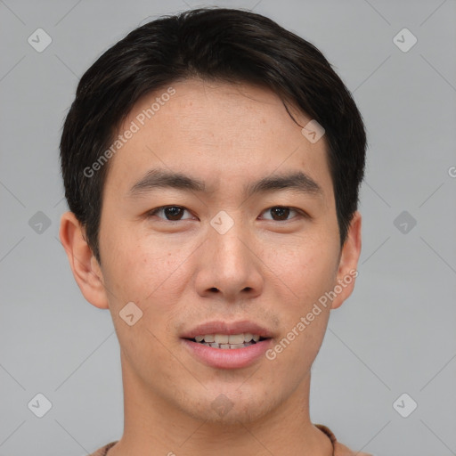 Joyful asian young-adult male with short  brown hair and brown eyes