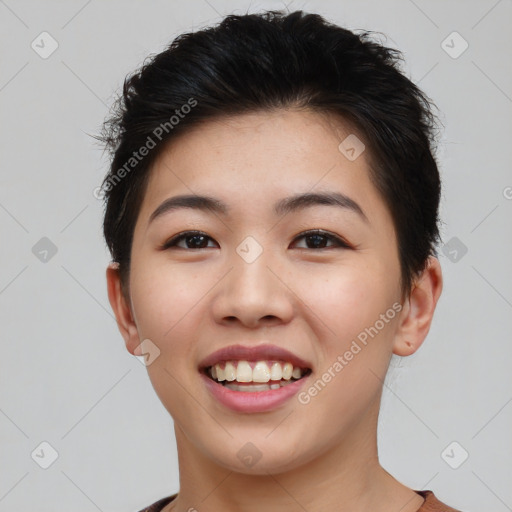 Joyful asian young-adult female with short  brown hair and brown eyes