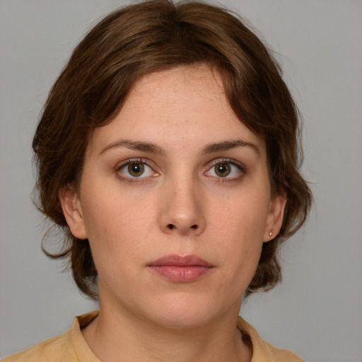 Neutral white young-adult female with medium  brown hair and brown eyes