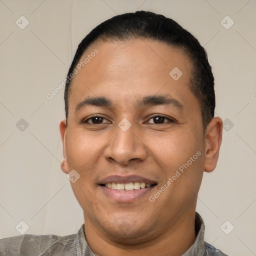 Joyful latino young-adult male with short  black hair and brown eyes