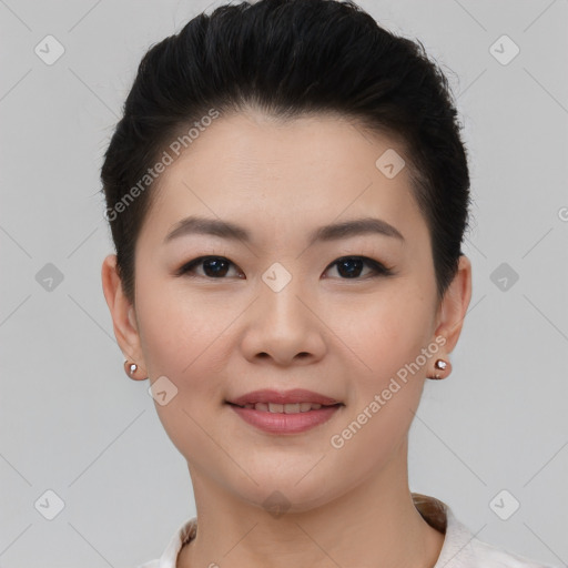 Joyful asian young-adult female with short  brown hair and brown eyes