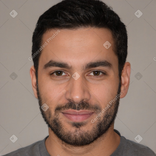 Joyful white young-adult male with short  black hair and brown eyes