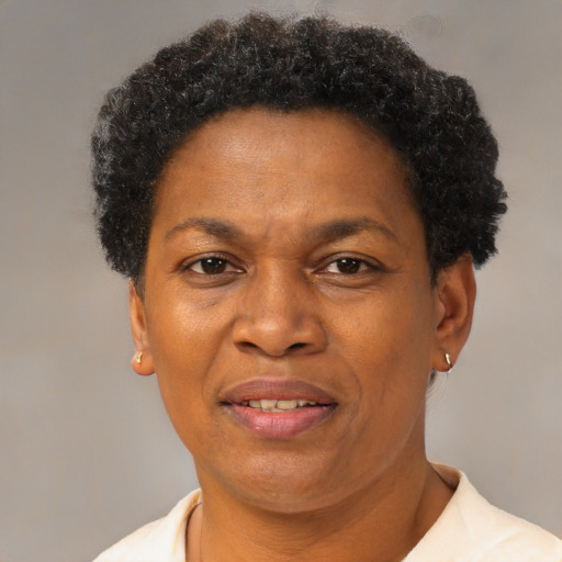 Joyful black adult female with short  brown hair and brown eyes