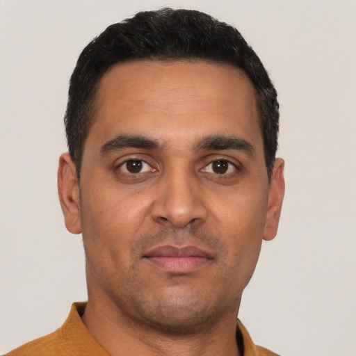 Neutral latino young-adult male with short  black hair and brown eyes