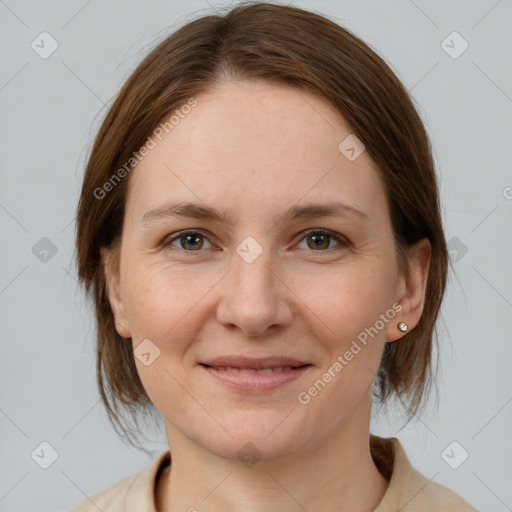 Joyful white young-adult female with medium  brown hair and grey eyes