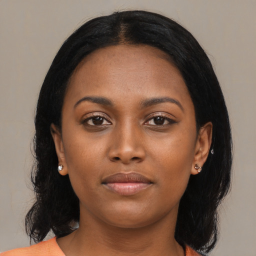 Neutral black young-adult female with medium  black hair and brown eyes