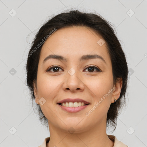 Joyful asian young-adult female with medium  brown hair and brown eyes