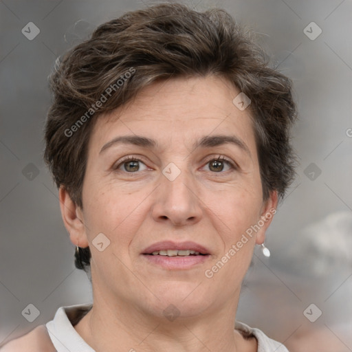 Joyful white adult female with short  brown hair and brown eyes