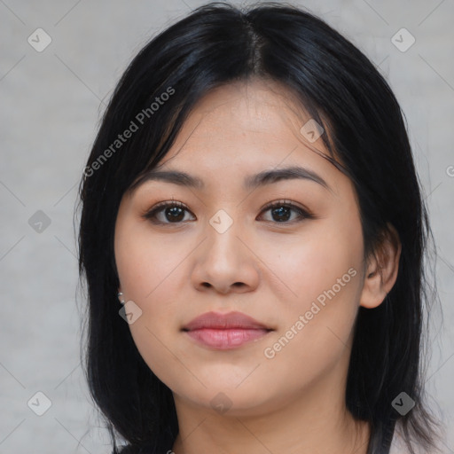 Joyful latino young-adult female with medium  black hair and brown eyes