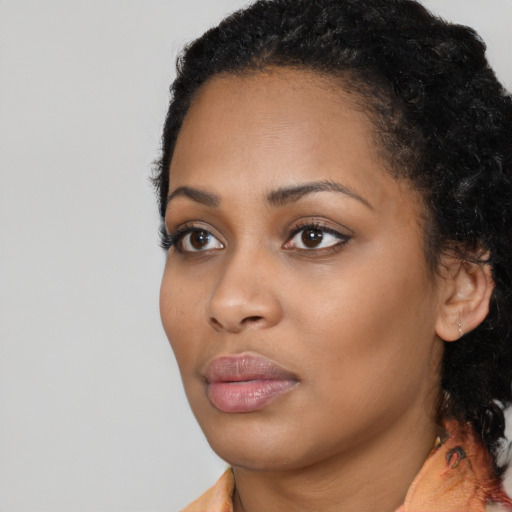 Neutral black young-adult female with long  black hair and brown eyes