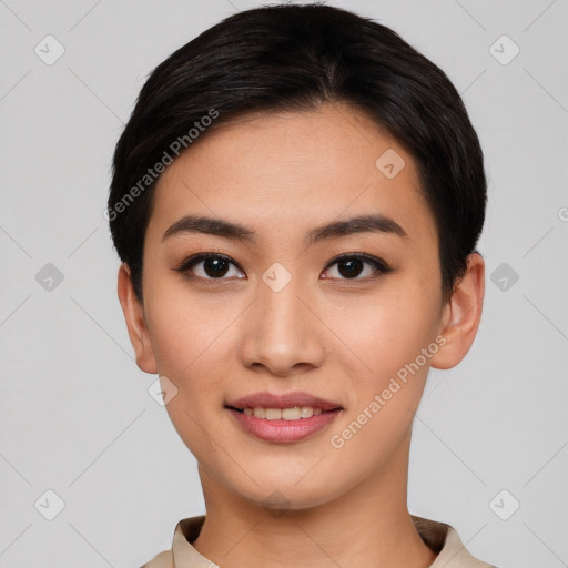 Joyful asian young-adult female with short  black hair and brown eyes