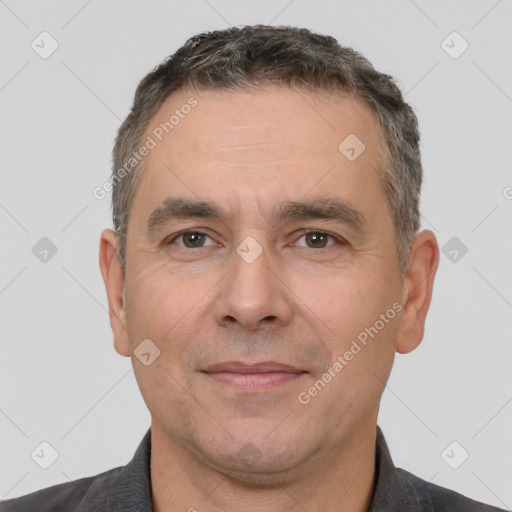 Joyful white adult male with short  brown hair and brown eyes