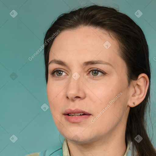 Joyful white adult female with long  brown hair and brown eyes