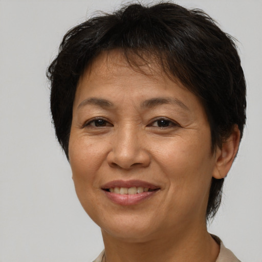 Joyful white adult female with short  brown hair and brown eyes