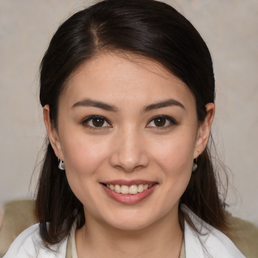 Joyful white young-adult female with medium  brown hair and brown eyes