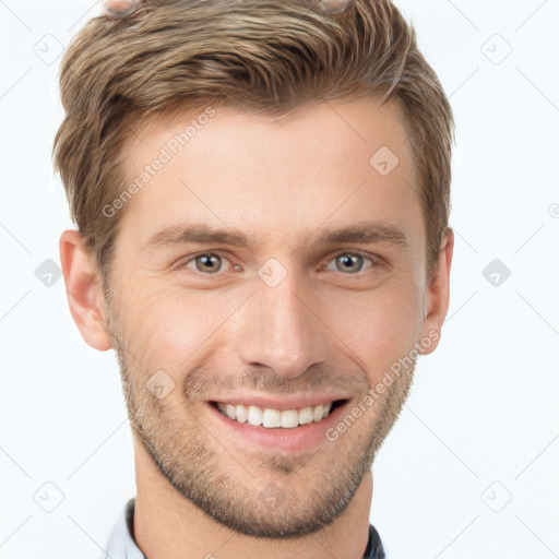 Joyful white young-adult male with short  brown hair and grey eyes