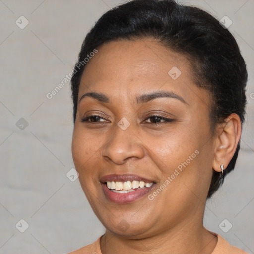 Joyful latino adult female with short  brown hair and brown eyes