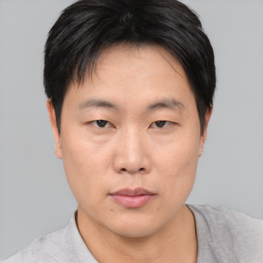 Neutral asian young-adult male with short  black hair and brown eyes
