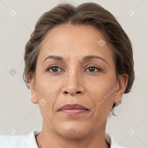 Joyful white adult female with short  brown hair and brown eyes