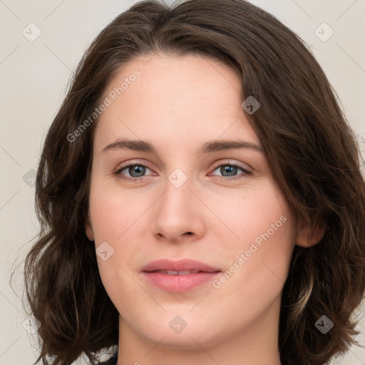 Joyful white young-adult female with long  brown hair and green eyes