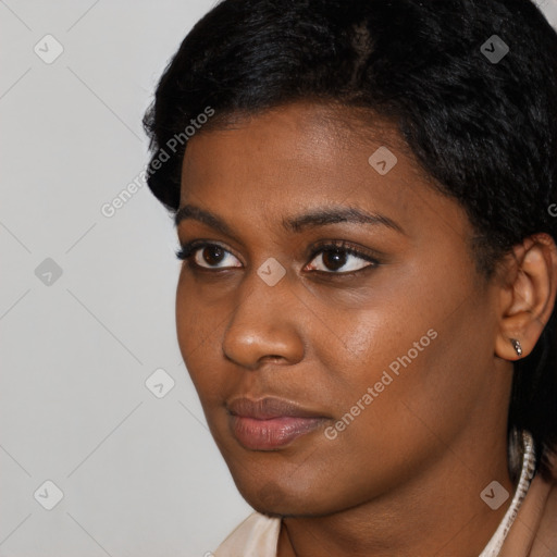 Neutral black young-adult female with short  black hair and brown eyes