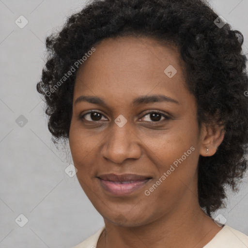 Joyful black young-adult female with medium  black hair and brown eyes