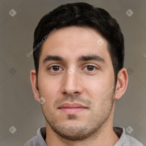 Neutral white young-adult male with short  black hair and brown eyes