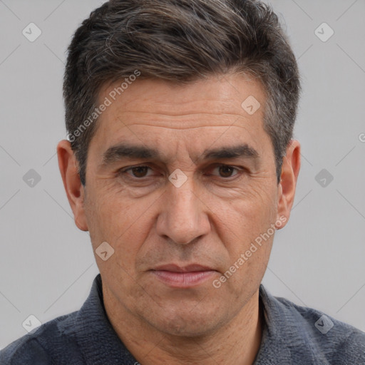 Joyful white middle-aged male with short  brown hair and brown eyes