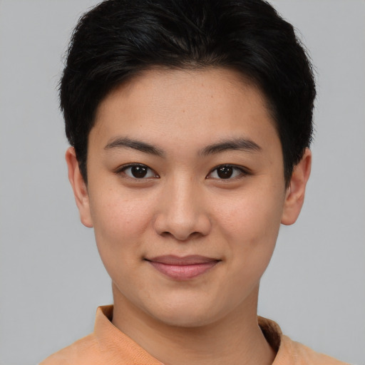 Joyful asian young-adult female with short  brown hair and brown eyes