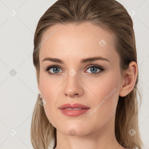 Joyful white young-adult female with long  brown hair and blue eyes