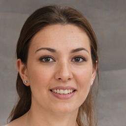 Joyful white young-adult female with medium  brown hair and grey eyes