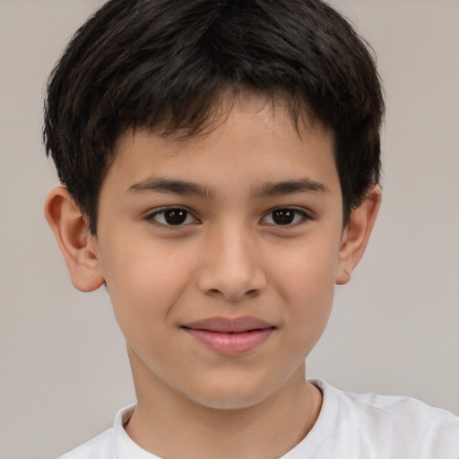 Joyful white child male with short  brown hair and brown eyes
