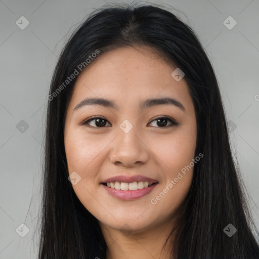 Joyful asian young-adult female with long  brown hair and brown eyes