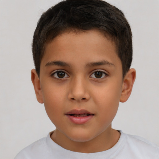 Joyful white child male with short  brown hair and brown eyes