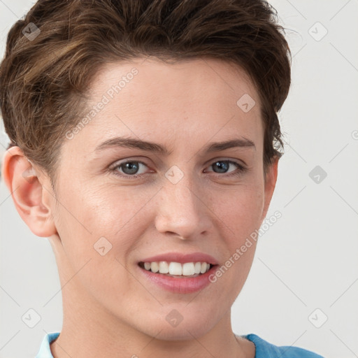 Joyful white young-adult female with short  brown hair and grey eyes