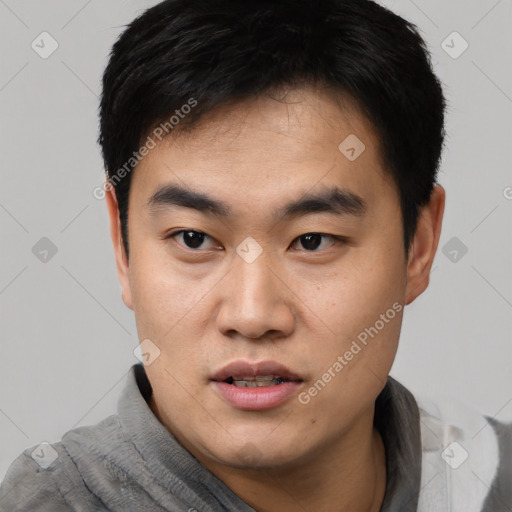 Neutral asian young-adult male with short  black hair and brown eyes